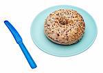 Everything Bagel on a Plate with a Knife. Isolated on White with a Clipping Path.