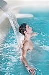spa hydrotherapy man waterfall jet turquoise swimming pool water