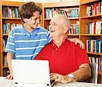 Father and son enjoying quality time together at the library.