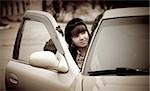 Young woman in a retro car, vintage style