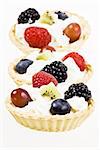 Cakes with fresh fruits and cream