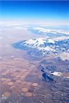 Aerial view of mountains covered with snow.