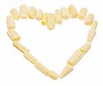 Baby corn in a heart shape isolated on white with a clipping path.