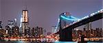 Panorama view. New York City Manhattan skyline with Brooklyn bridge at night.