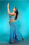 Beautiful sexy dancer woman in bellydance costume with pretty professional stage make-up