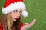 Teenager with red lips wearing a christmas hat