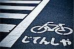 zebra crossing and bicycle sign on the street in japan.