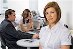 Young business group with businesswoman in office