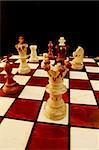 chess pieces on chess board showing competition success and strategy in business