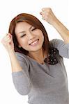 Happy excited woman of Asian, closeup portrait over white background.
