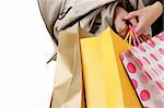 Closeup image of shopping woman holding bags.