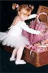 Little ballet toddler wearing a white tutu