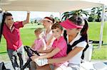 golf course mothers and daughters in buggy talking father