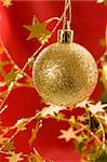 Holiday series:  Christmas decorated golden ball in red background