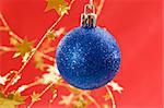 Holiday series: blue Christmas ball with decorated background