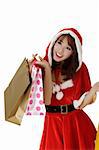 Happy shopping woman with bags in Santa Claus clothes.