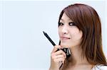 asian casual women smiling holding a pen