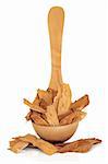 Astragalus root in an olive wood ladle and scattered, isolated over white background. Used extensively in chinese herbal medicine to speed healing and treat diabetes. Zhi huang qui. Astragali radix.