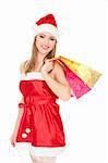 Pretty girl in a red Christmas hat with colorful bags isolated over white background.