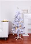 White Christmas tree in white tone at home