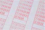 A paper lottery ticket with selective focus