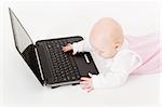 baby with laptop on a white background in studio