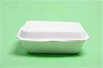 Polystyrene Food Box on green Background