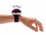 Purple pincushion bracelet with pins on the wrist,  isolated on white