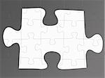 Jigsaw puzzle pieces isolated against a grey background