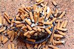 ashtray full of cigarettes close-up