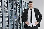 young handsome business man  engeneer in datacenter server room