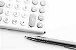 financial accounting concept with white calculator in office