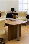 Beige leather armchairs at modern new office