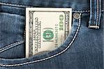 A one hundred dollar note in the front pocket of denim trousers