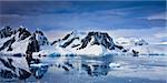 Beautiful snow-capped mountains against the blue sky in Antarctica