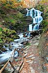 Waterfalls on Rocky Stream, Running Through Autumn Mountain Forest