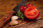 Tomatoes on the old wooden table