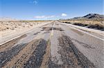 Muddy road through a winter desert scene, Mojave National Preserve, California