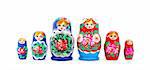 Set of russian nested dolls standing in a row on white background