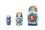 Russian nested dolls standing in a row on white background