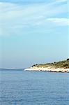 Typical Croatian coast, magical blue water, island, blue sky