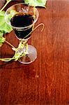 red wine glass on wood background