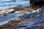 Marine waves with suds and sea-bottom  with stone