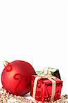 Red Christmas bauble and two gift boxes isolated on white background with copy space.