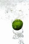 Fresh lime is dropped into water