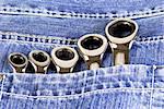 Five wrenches in a blue jeans pocket