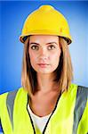 Young girl with hard hat against background