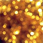 Bright abstract background with golden bokeh