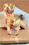 Healthy snack with carrot spread and salad in two glasses. Shallow dof