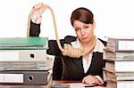 Woman in office with sling around head is forced to suicide because of bankruptcy.